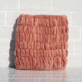 Kitsch dusty rose lifestyle bathroom counter in use for relaxed routines