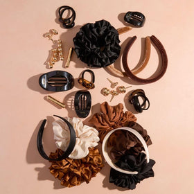 Kitsch gold barrettes in a gift-ready box highlighting ready-to-present appeal