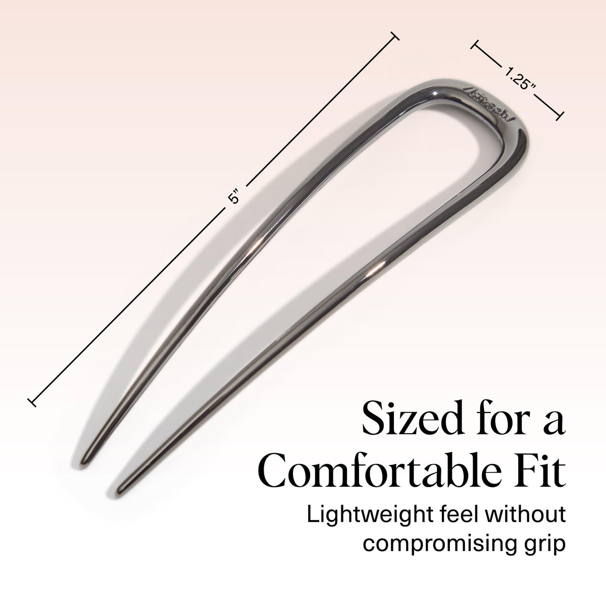 Kitsch hematite next to ruler showing compact size and easy portability for travel