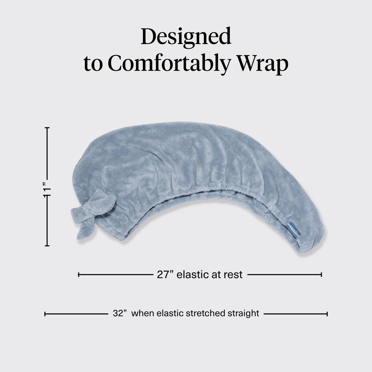 Kitsch side profile of towel secured with loop and button for slip-free convenience