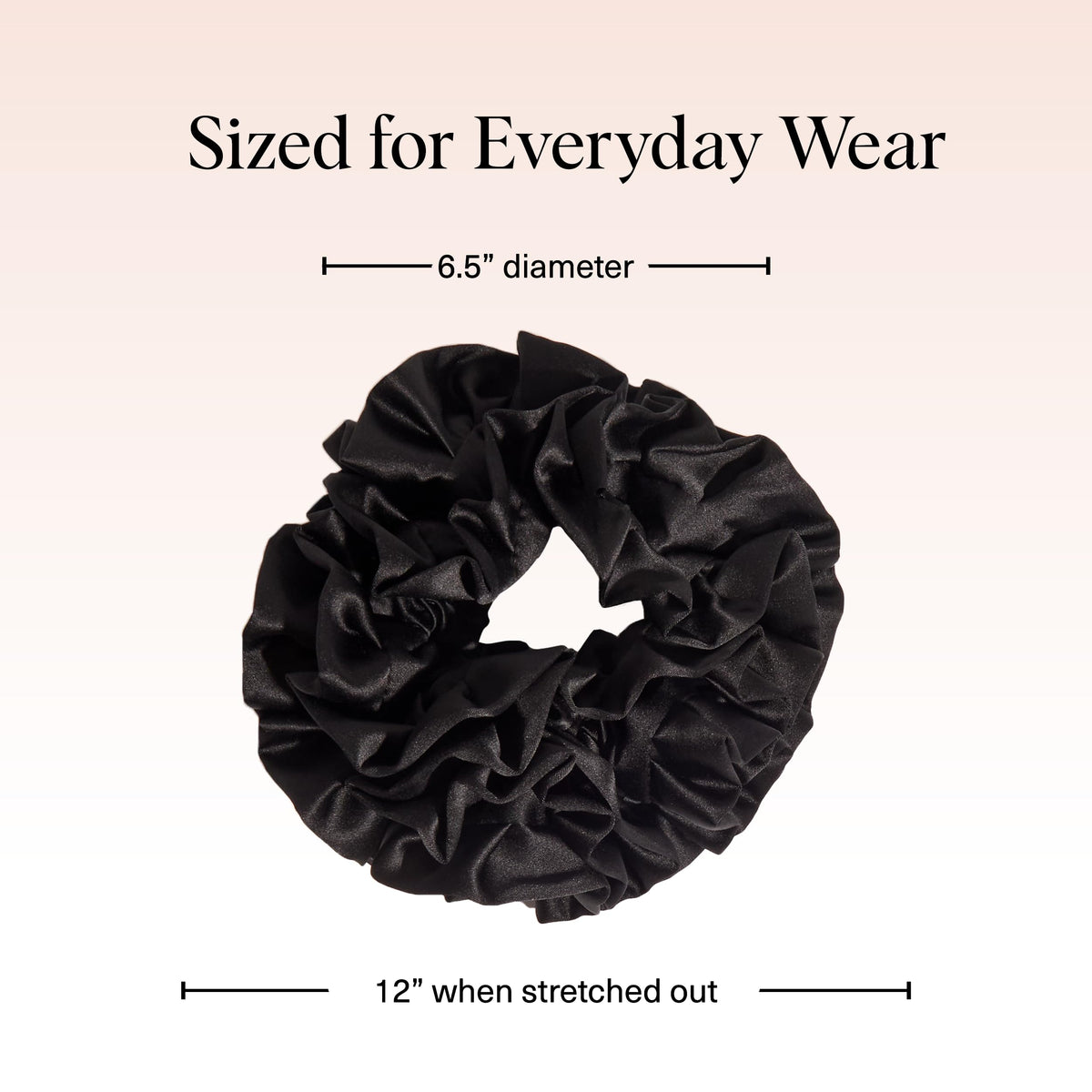 Kitsch scrunchie styled in a bun showing ruffle detail and soft finish