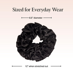 Kitsch scrunchie styled in a bun showing ruffle detail and soft finish