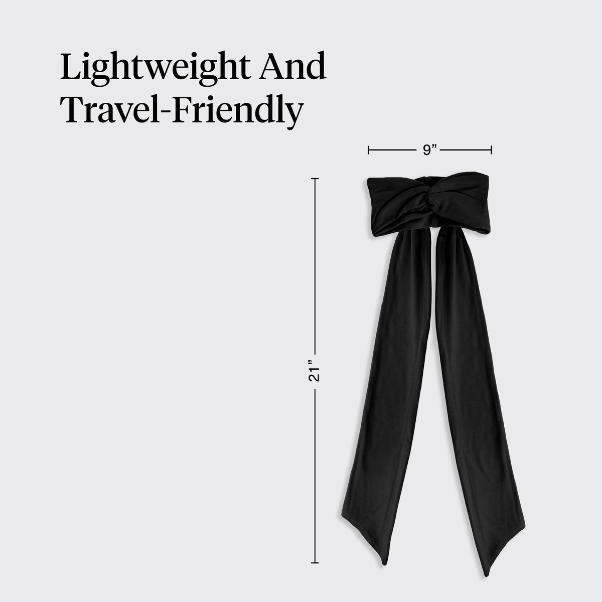 Kitsch headband in hand to show compact travel-friendly size