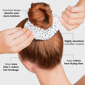 Kitsch scrunchie securing hair and reducing drying time in use