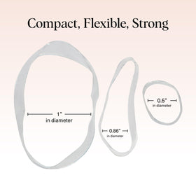 Kitsch elastics beside a coin to show compact size and portability