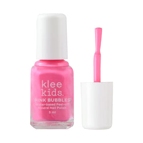 Klee Naturals kit held in child’s hand showing compact size and easy handling
