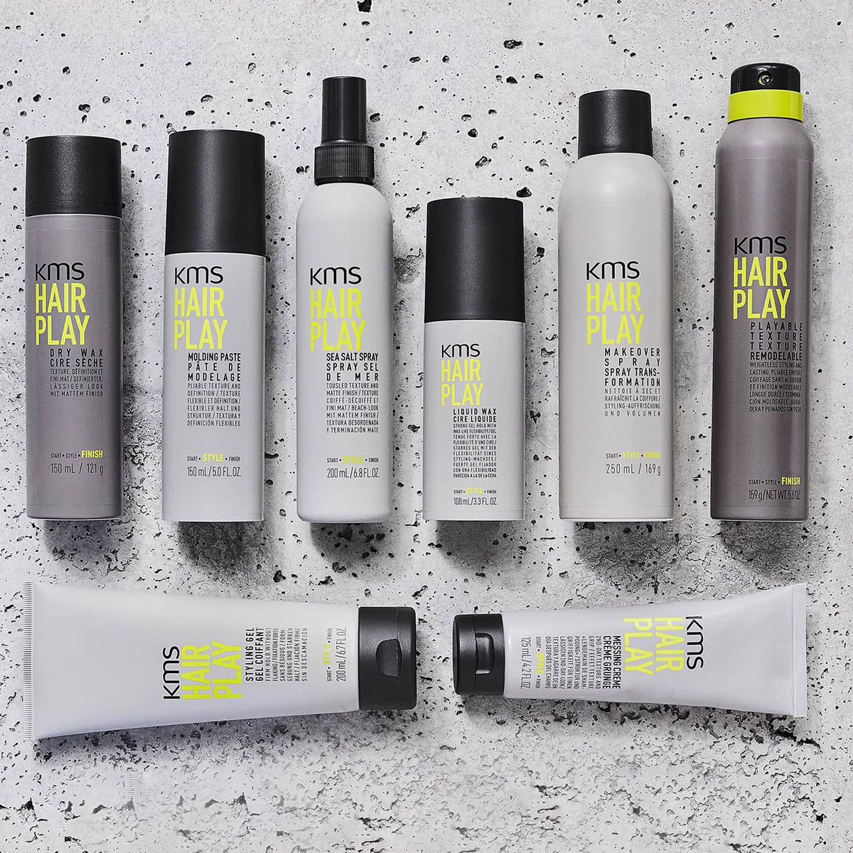 KMS lifestyle salon setting with stylist using spray for flexible styling