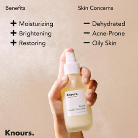 Knours bottle in hand showing 110ml travel-friendly size