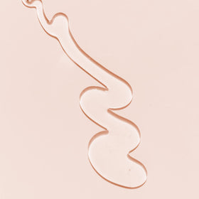Kopari bottle beside Coconut Body Milk showing layering for extra moisture