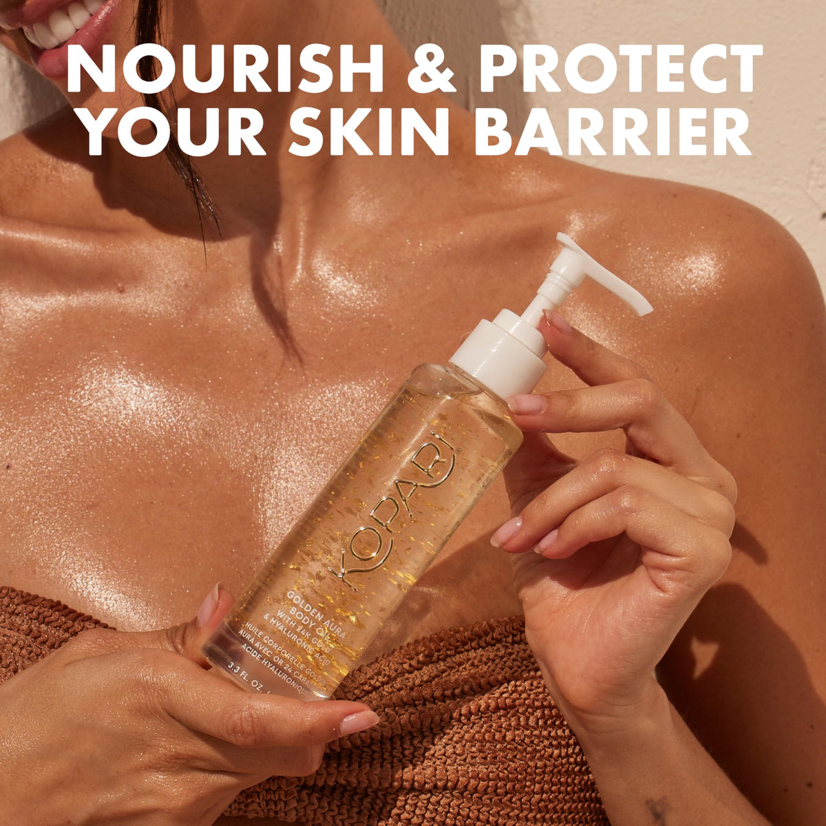 Kopari bottle next to hand showing 3.3 oz size and travel-friendly benefit
