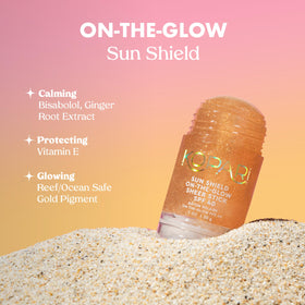 Kopari sun shield being applied on cheek for quick reapplication benefit