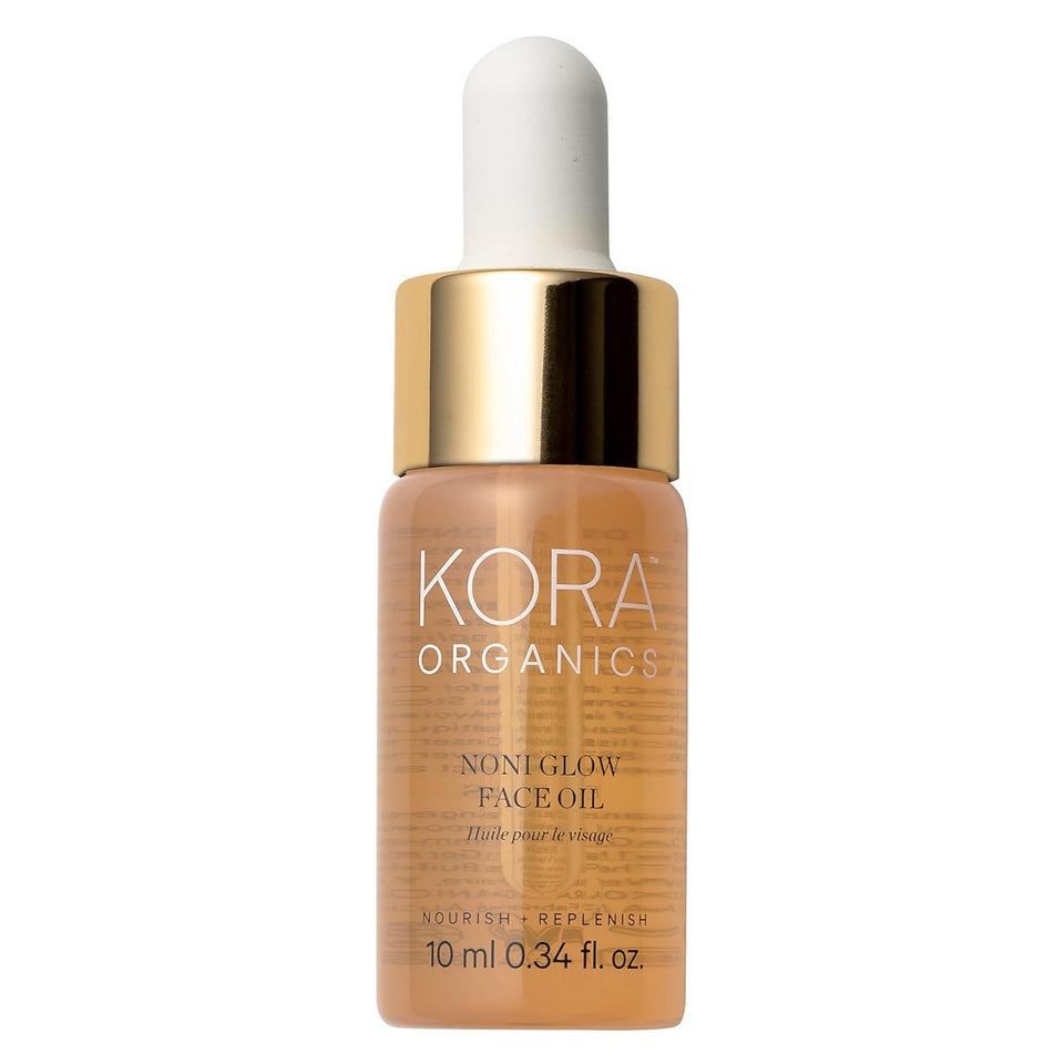 KORA Organics front packaging showing the noni glow oil and compact bottle benefit radiant skin