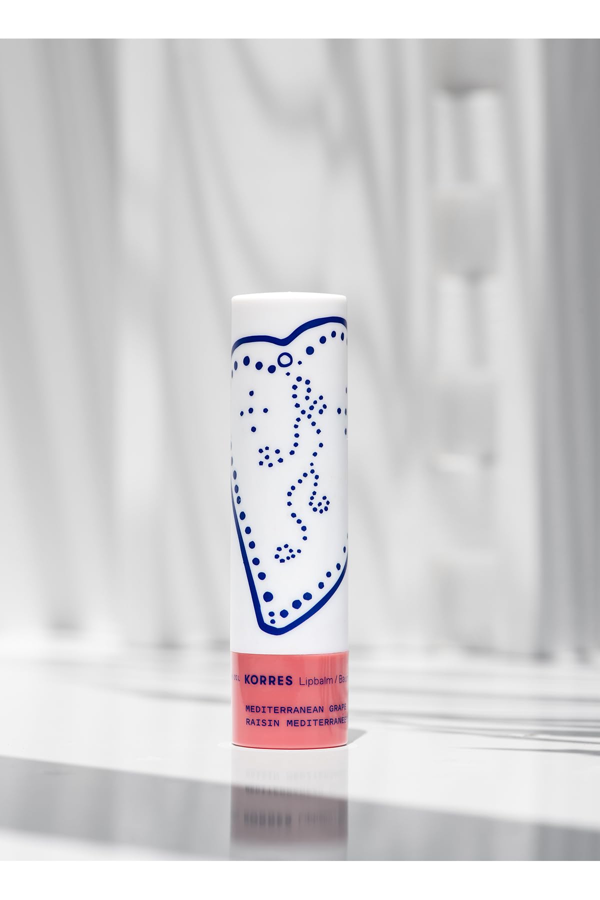 KORRES lip butter applied on lips demonstrating soft tint and immediate hydration