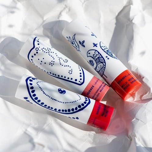 KORRES lip butter inside a purse ready for on-the-go hydration and subtle color
