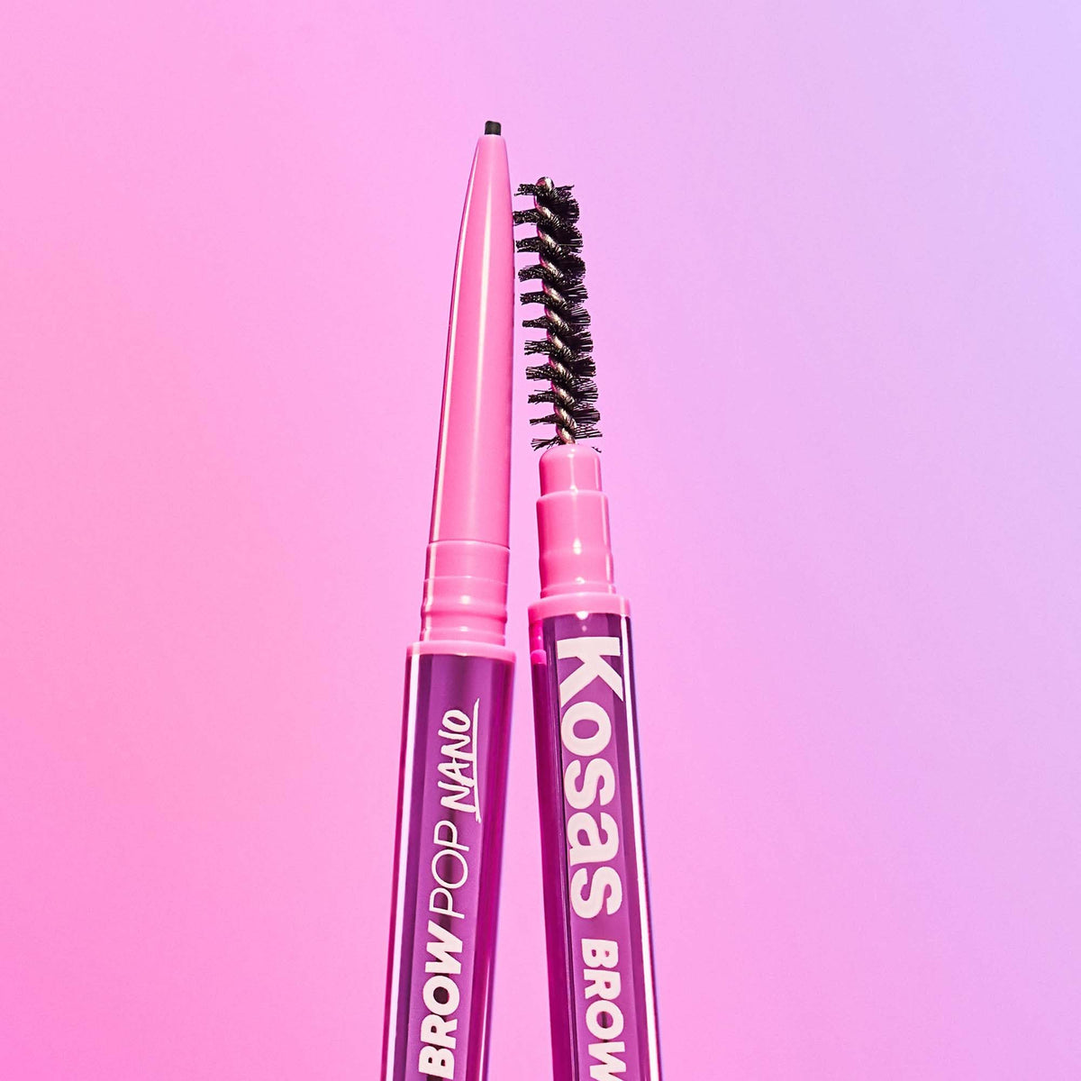 Kosas pencil held in hand to show slim scale and control