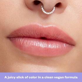 Kosas Wet Lip Oil Gloss layered over lipstick showing enhanced shine and depth