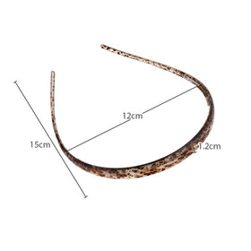 KOVOLITU headband beside coin showing compact size benefit