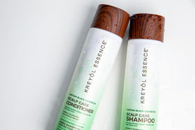 Kreyol Essence close-up label showing ingredients and eco-friendly message