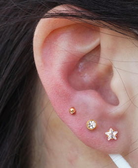 KRFY lifestyle image of pierced ear wearing included stud, showcasing finished look