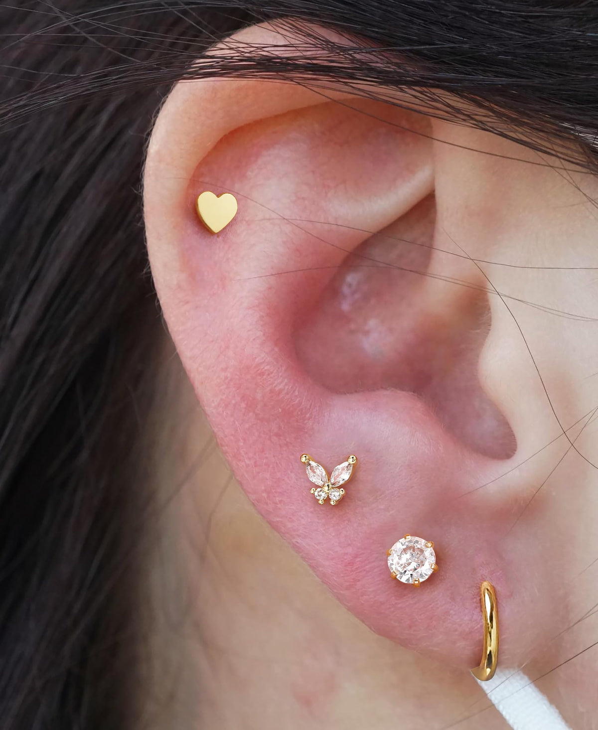 KRFY lifestyle image with person using kit demonstrating easy at-home piercing