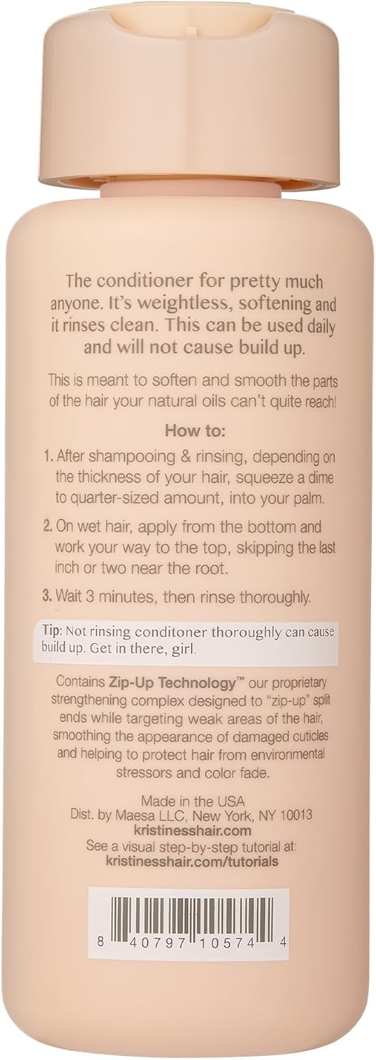 Kristin Ess conditioner creamy pour texture demonstrating lightweight slip benefit