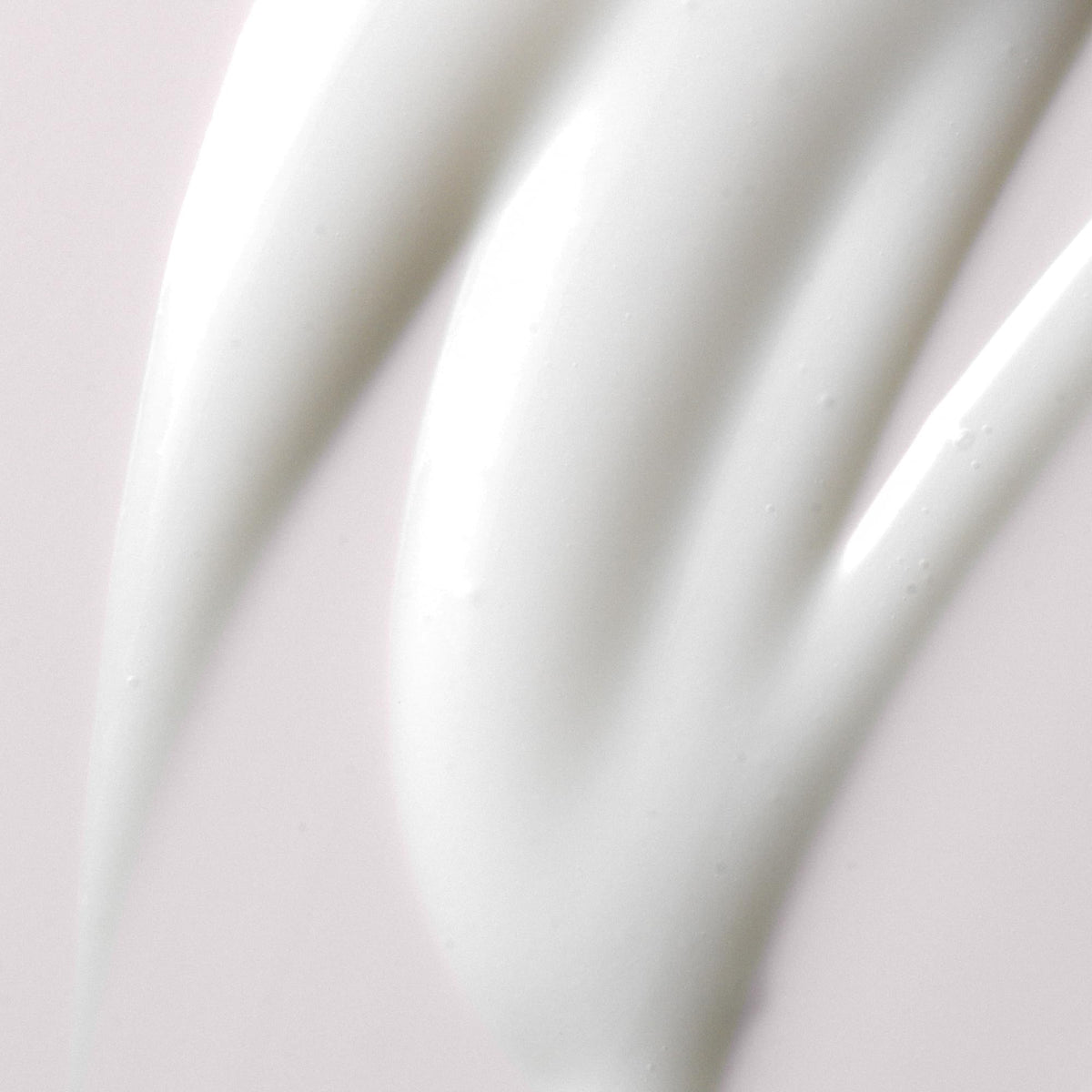 Kristin Ess cream texture swatch highlighting smooth hydration and slip