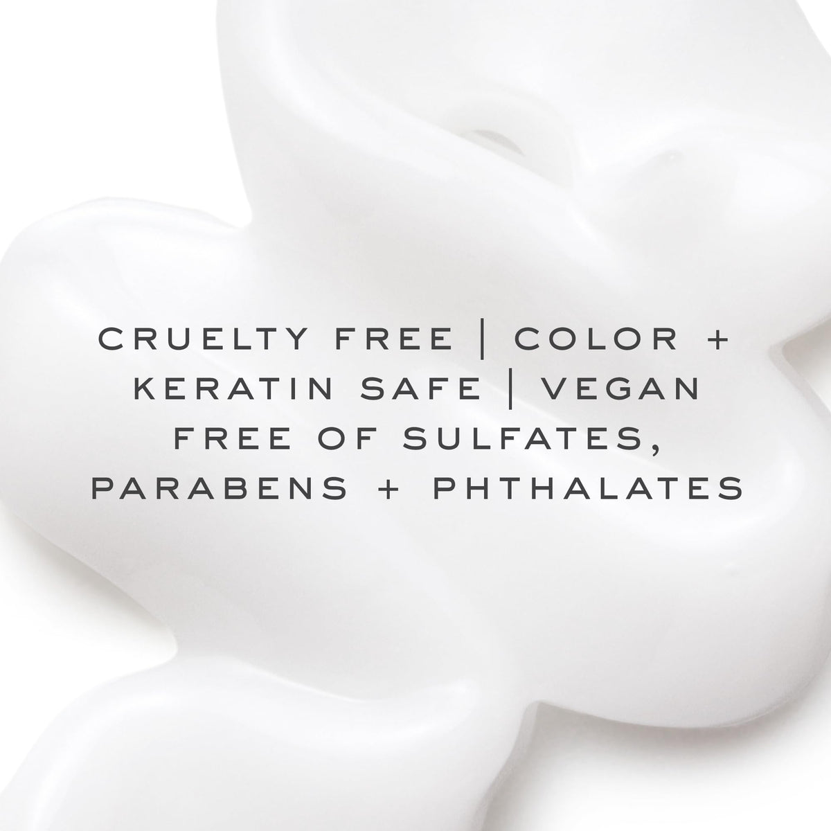 Kristin Ess label close-up showing biotin and amino acids for fortifying benefits