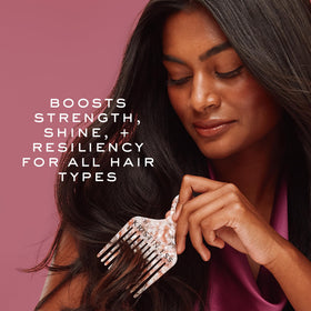 Kristin Ess conditioner on bathroom shelf styled for a lifestyle routine and organized benefit
