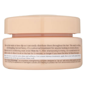 Kristin Ess open jar texture showcasing creamy moisturizing formula