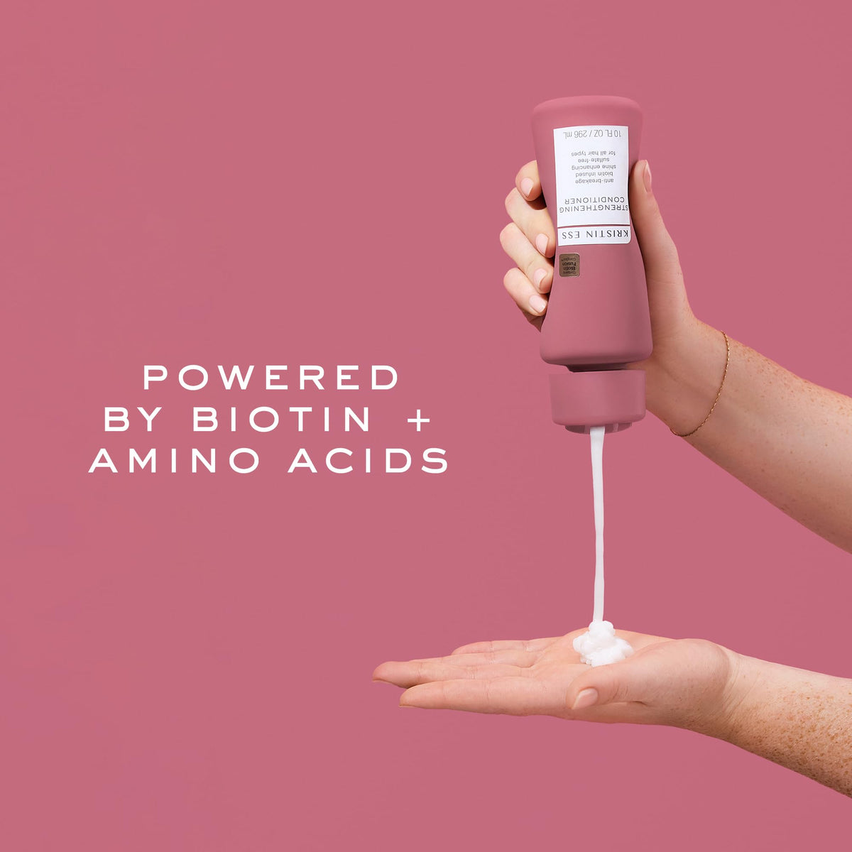 Kristin Ess dispensed conditioner texture showing creamy formula and easy application benefit