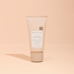 Kristin Ess duo in toiletry bag lifestyle image showing portability and travel-ready styling