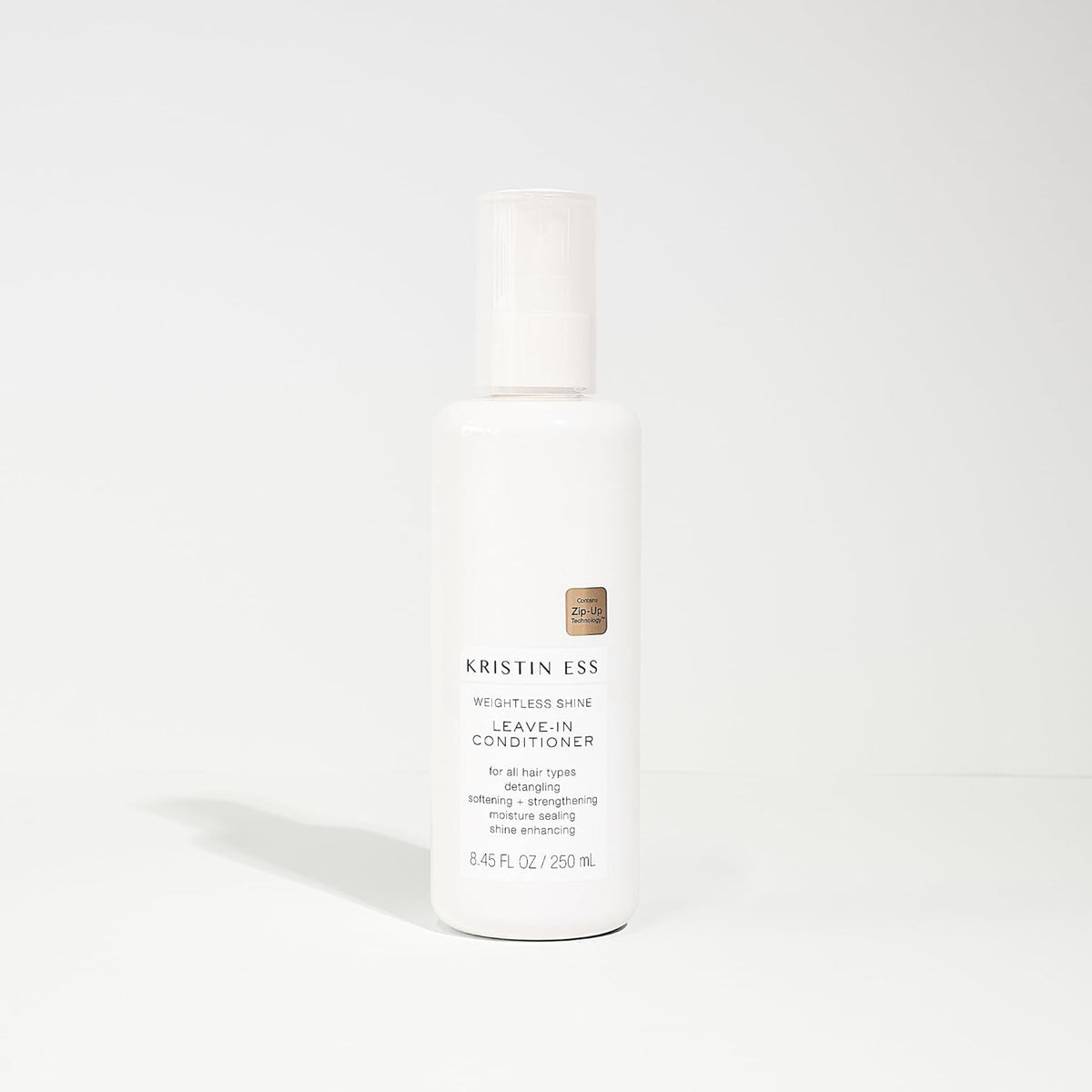 Kristin Ess hair in use being detangled for smoother styling and less breakage