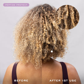 Kristin Ess bottle styled on bathroom shelf conveying salon-quality routine