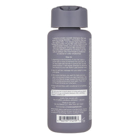 Kristin Ess purple shampoo pouring texture illustrating pigment and thickness