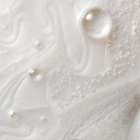 Kristin Ess cream texture illustrating moisturizing, non-greasy lather