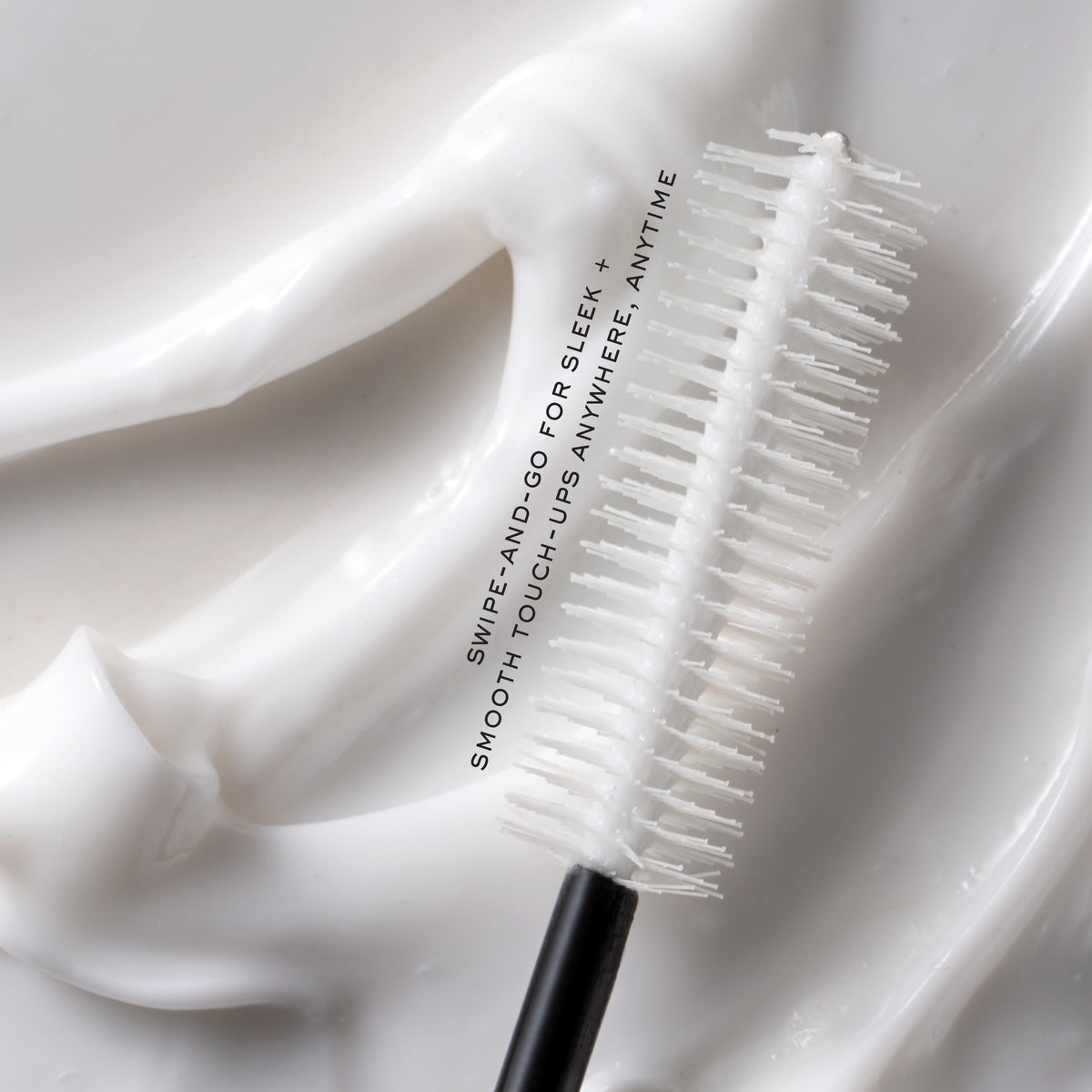 Kristin Ess sleek ponytail after use illustrating frizz control benefit