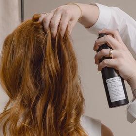Kristin Ess texture spray mist dispersing to create soft matte finish