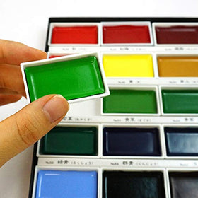 Kuretake Gansai Tambi close-up of oversized pans revealing rich pigment texture