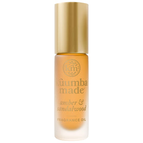 Kuumba Made front packaging showing warm amber bottle and label benefit long-lasting scent