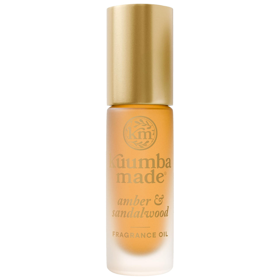 Kuumba Made front packaging showing warm amber bottle and label benefit long-lasting scent