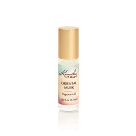 Kuumba Made front view of roll-on bottle showing label and compact design, easy travel