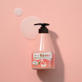 Shower shelf scene with Kwailnara Peach Milk bottle conveying a soothing ritual