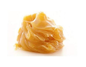 Kyabo lanolin jar with spatula portioning cleanly, enables hygienic use