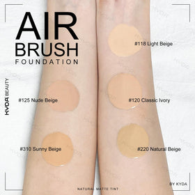 KYDA brush applying spray foundation to face, ensures streak-free blending