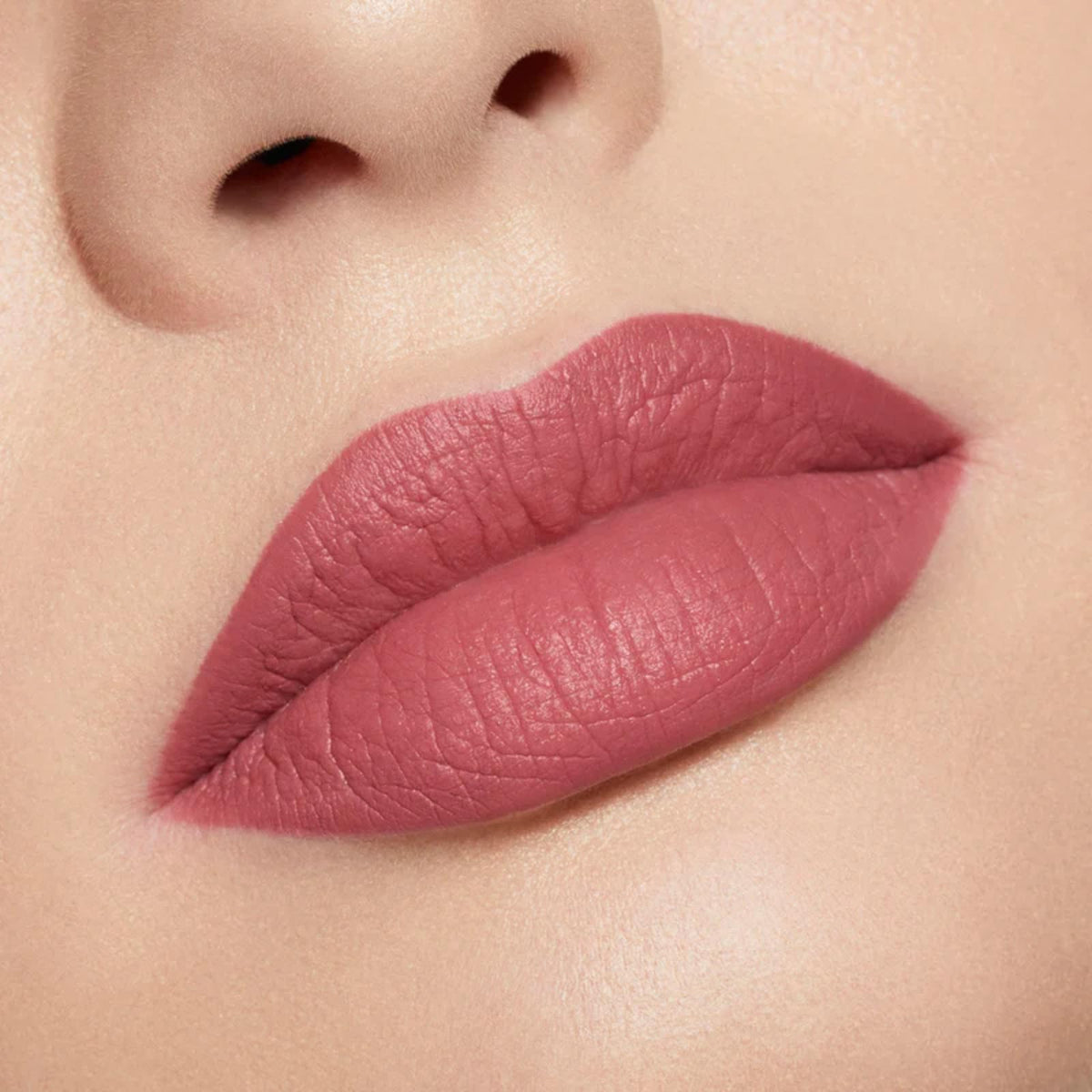 Kylie Cosmetics Posie K applicator and texture close-up illustrating smooth glide