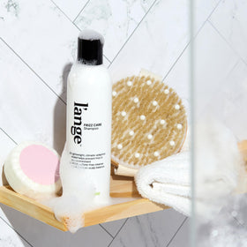 l'ange hair creamy shampoo texture on palm showing smooth application and slip