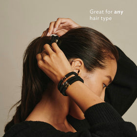L. Erickson black bead detail showing polished finish and subtle accent