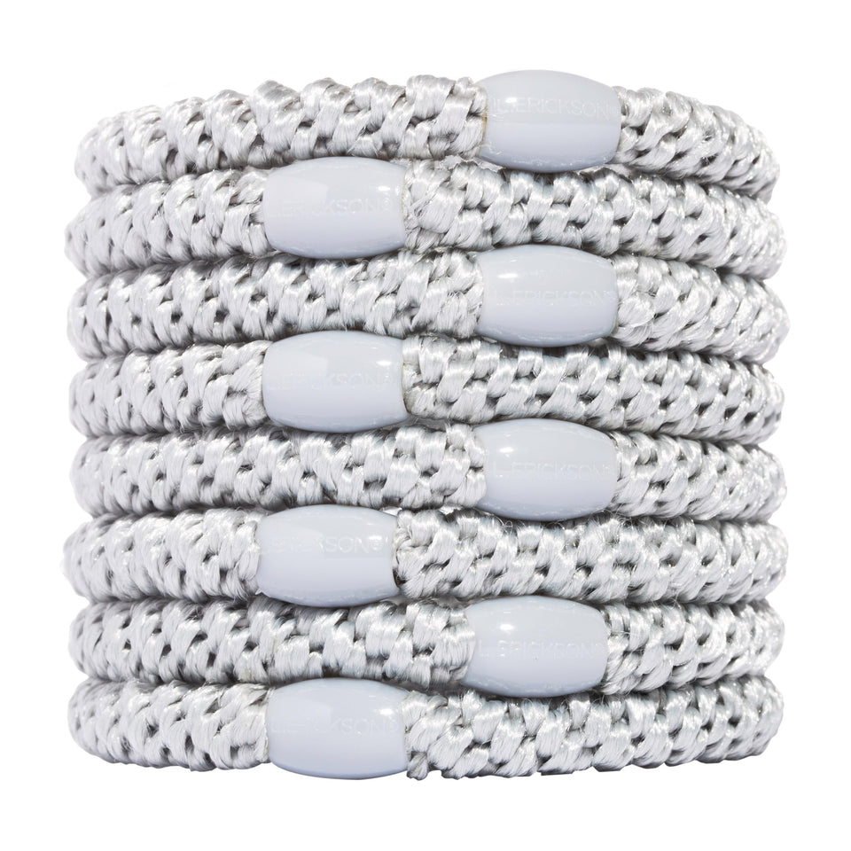 L. Erickson front view of eight silver hair ties showing color and bead for polished hold