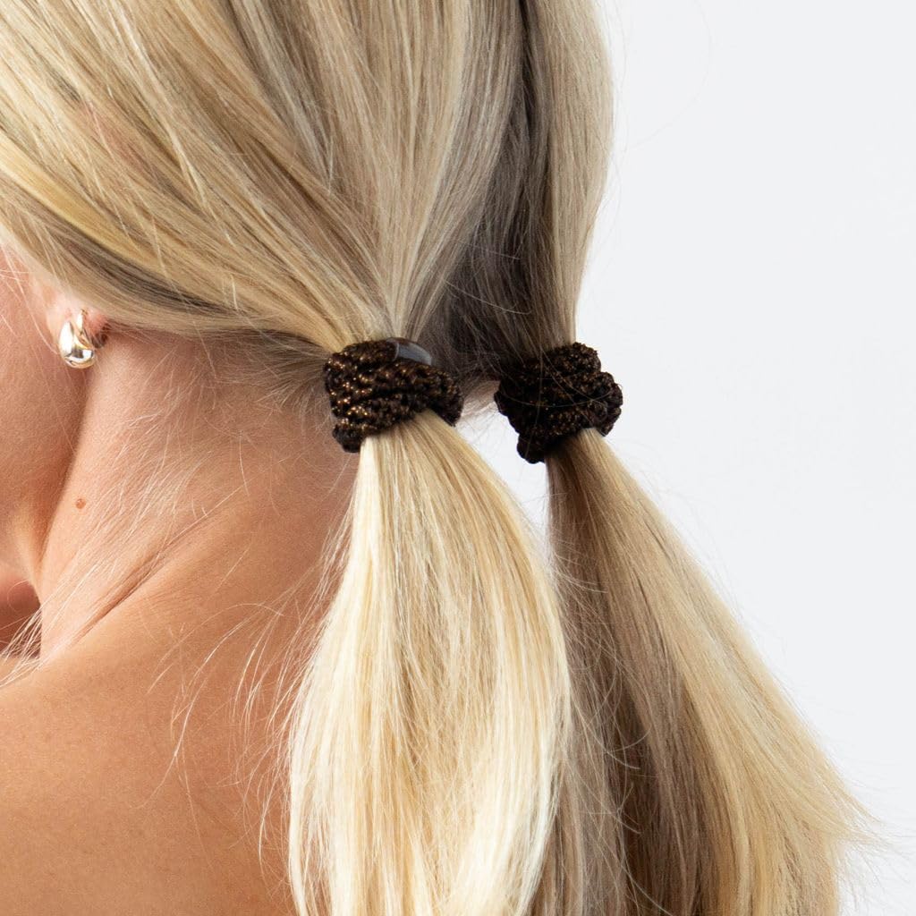 L. Erickson lifestyle image of woman tying hair fast and comfortably