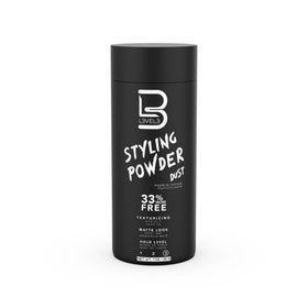 Barber sprinkling L3 powder in a salon to add texture and quick volume